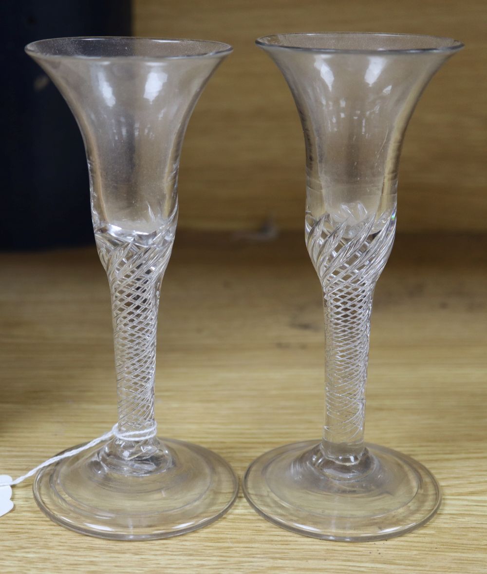 A pair of Georgian wine glasses, each with trumpet bowl, air twist stem and folded foot, height 17cm